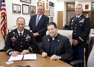 The Rev. James J. Maher, C.M., Niagara University president, and Lt. Col. Gary Love, chair of NU’s military science department, signed the Sexual Assault Prevention Partnership Charter on Sept. 22. They were joined by Dr. Michael Anderson, deputy commander of the Second ROTC Brigade, and Capt. Brian Wheat, assistant professor of military science.